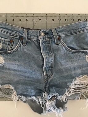 Levi’s 501 distressed button fly light blue booty shorts